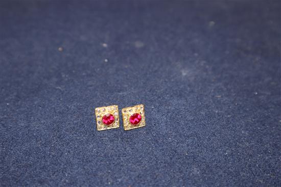 A pair of yellow metal, red stone and rose cut diamond set tablet ear studs.